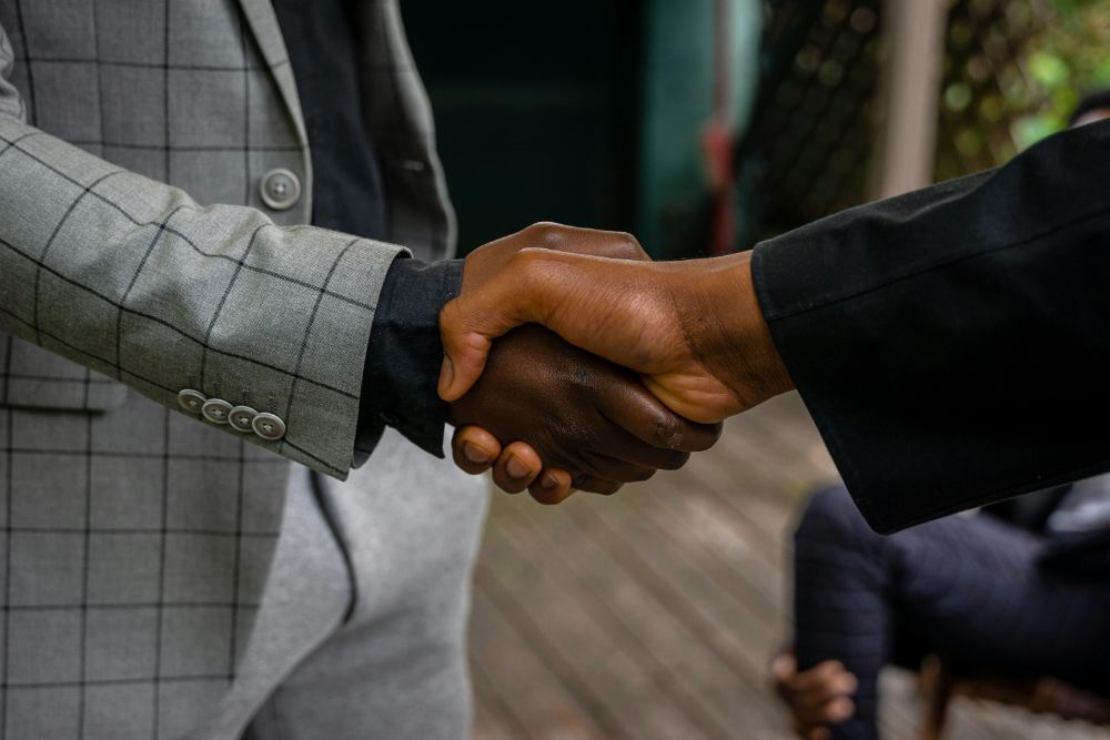 Two people shaking hands on a finished engagement